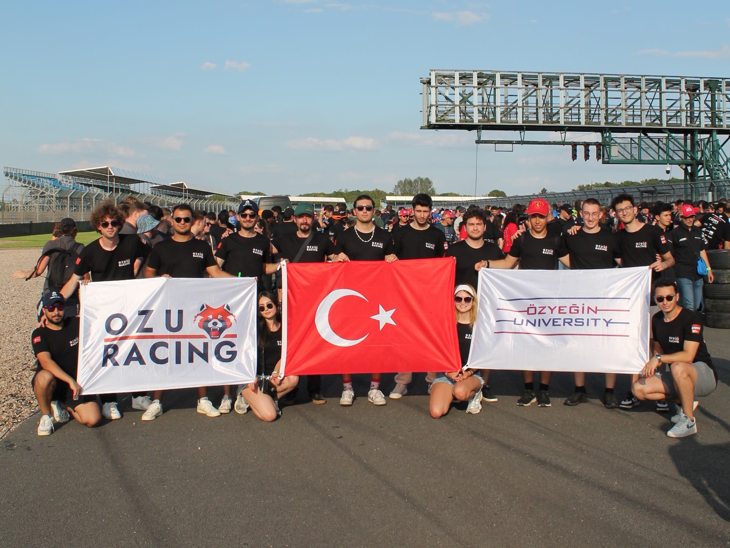 Team photo of Ozu Racing at Silverstone Circuit